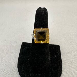 Vintage silver tone ring with square citrine colored glass stone.